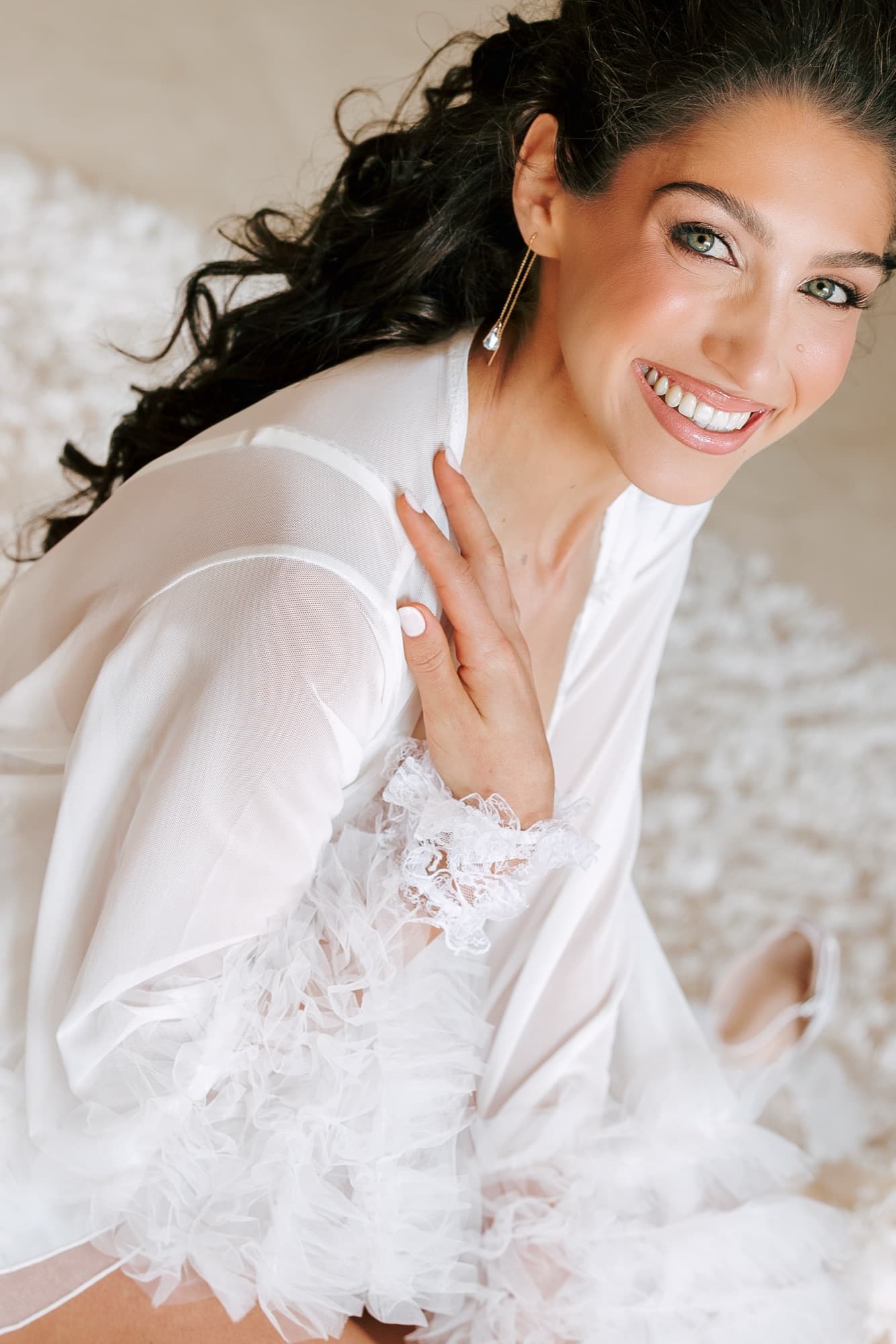 Bride smiling in tulle robe, joyful bridal portrait, luxury wedding photography South Africa