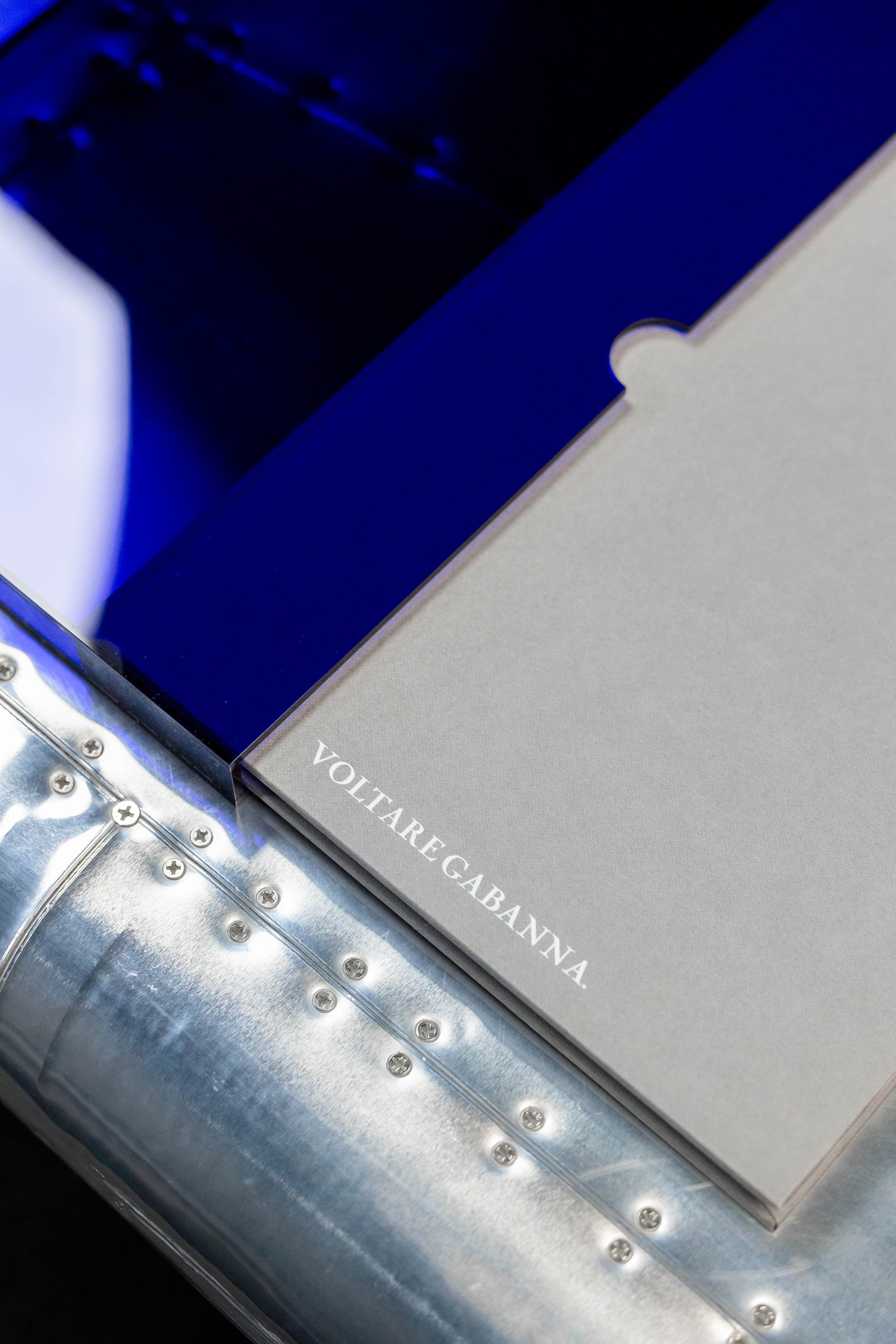 Album resting beside its perspex presentation box