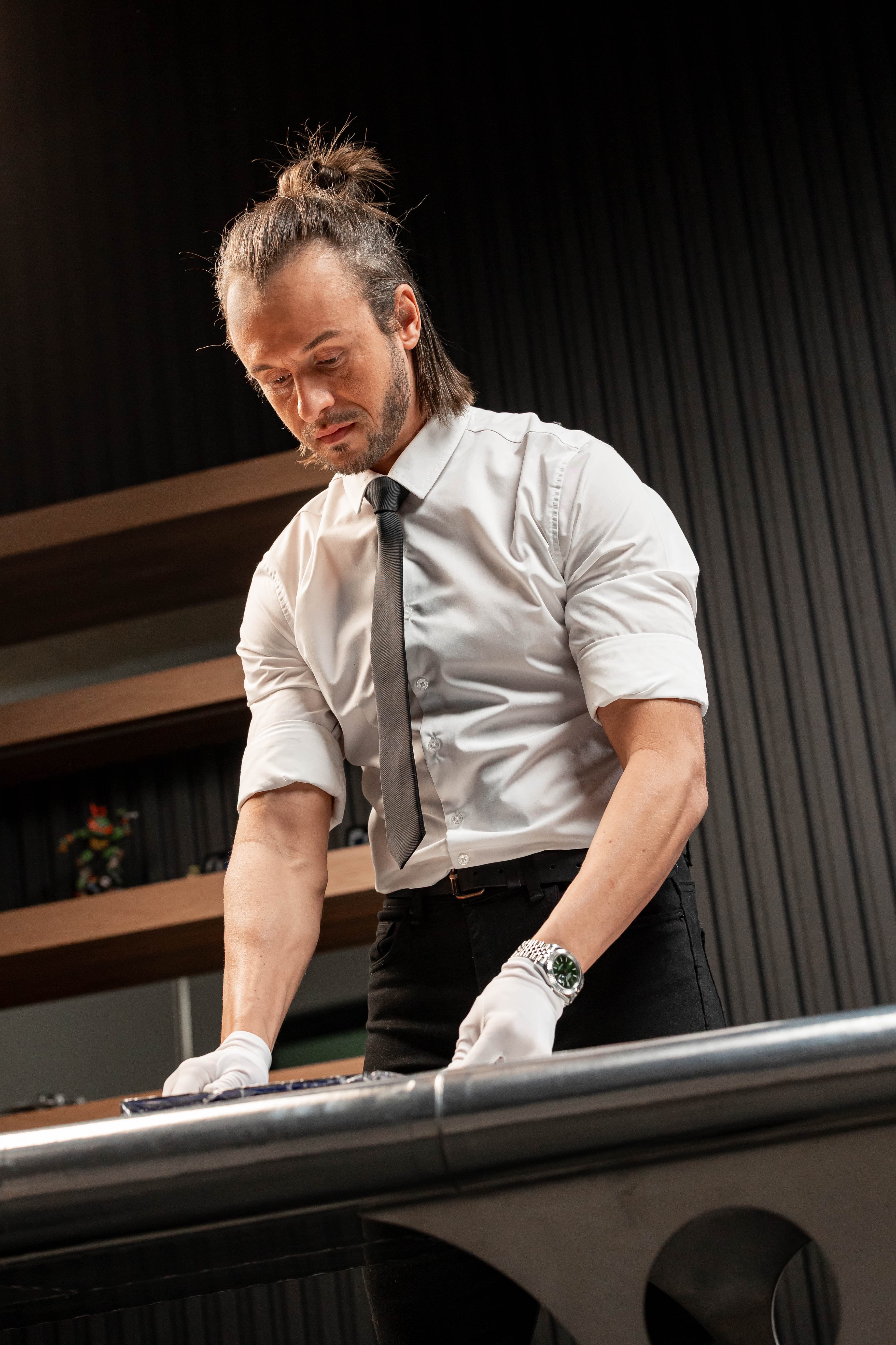 Craftsman preparing the Unveiled luxury wedding album