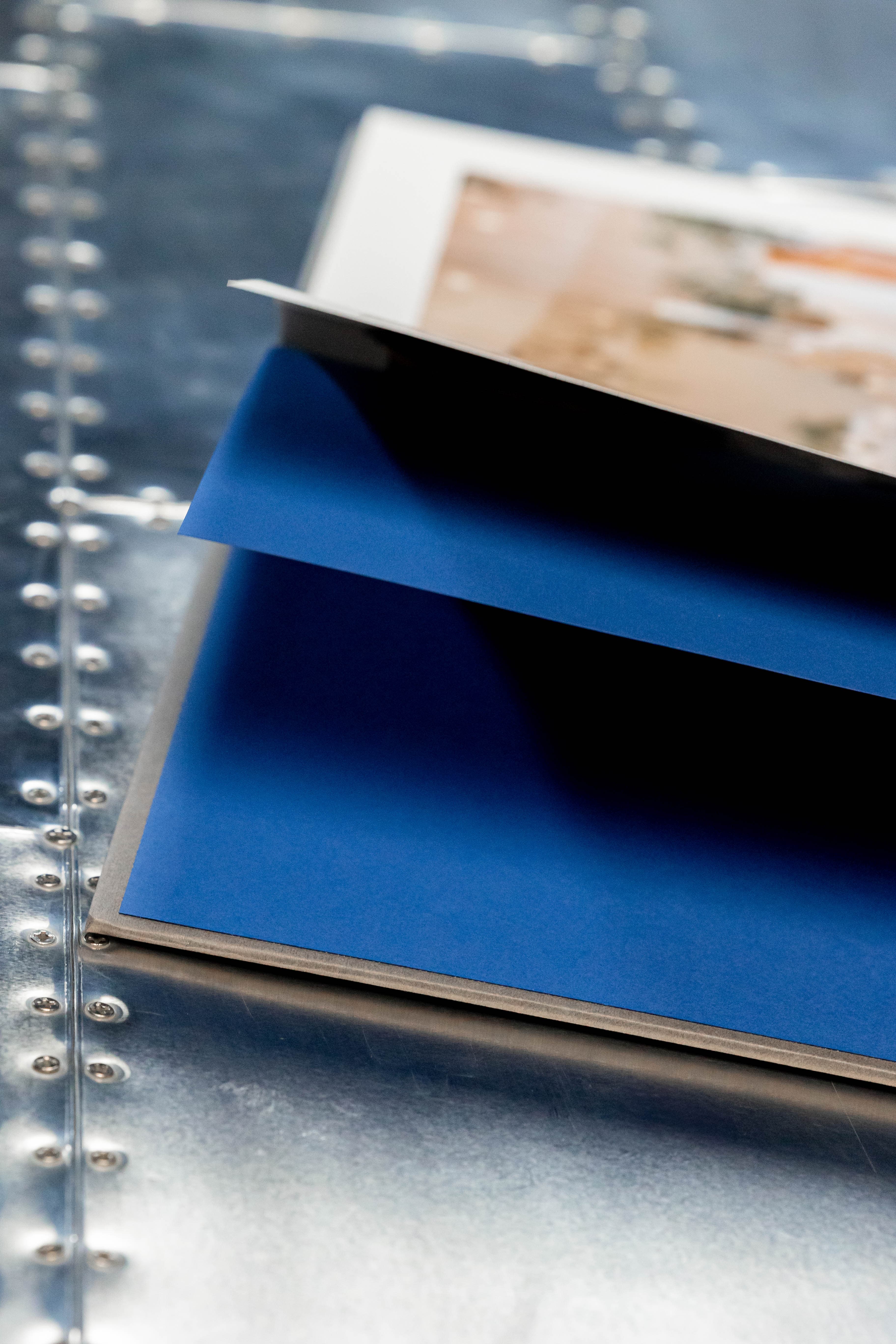 Royal blue hand-stitched pages inside the album